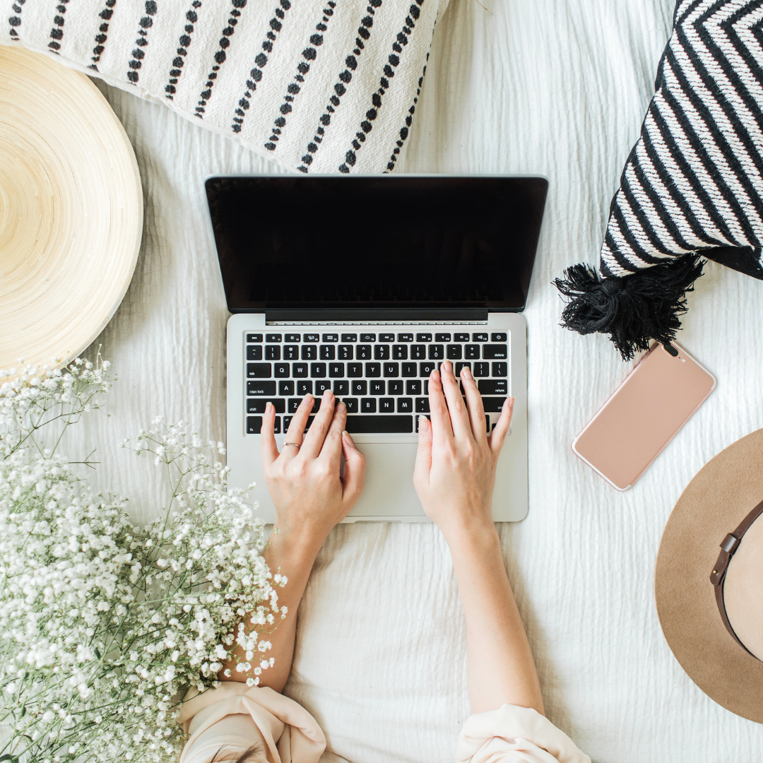 Online business manager working at laptop