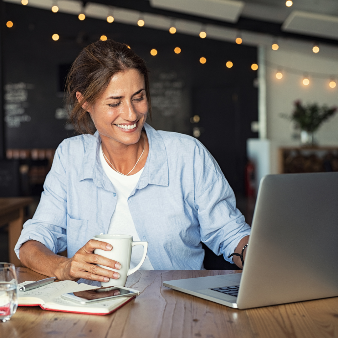 Woman solopreneur sitting at laptop