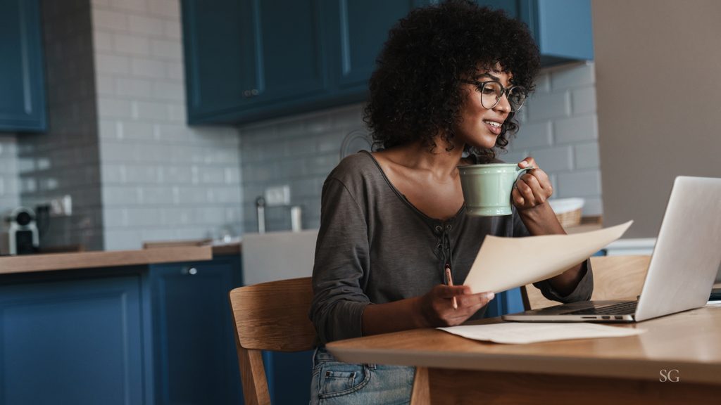 Female entrepreneur at computer updating her offer